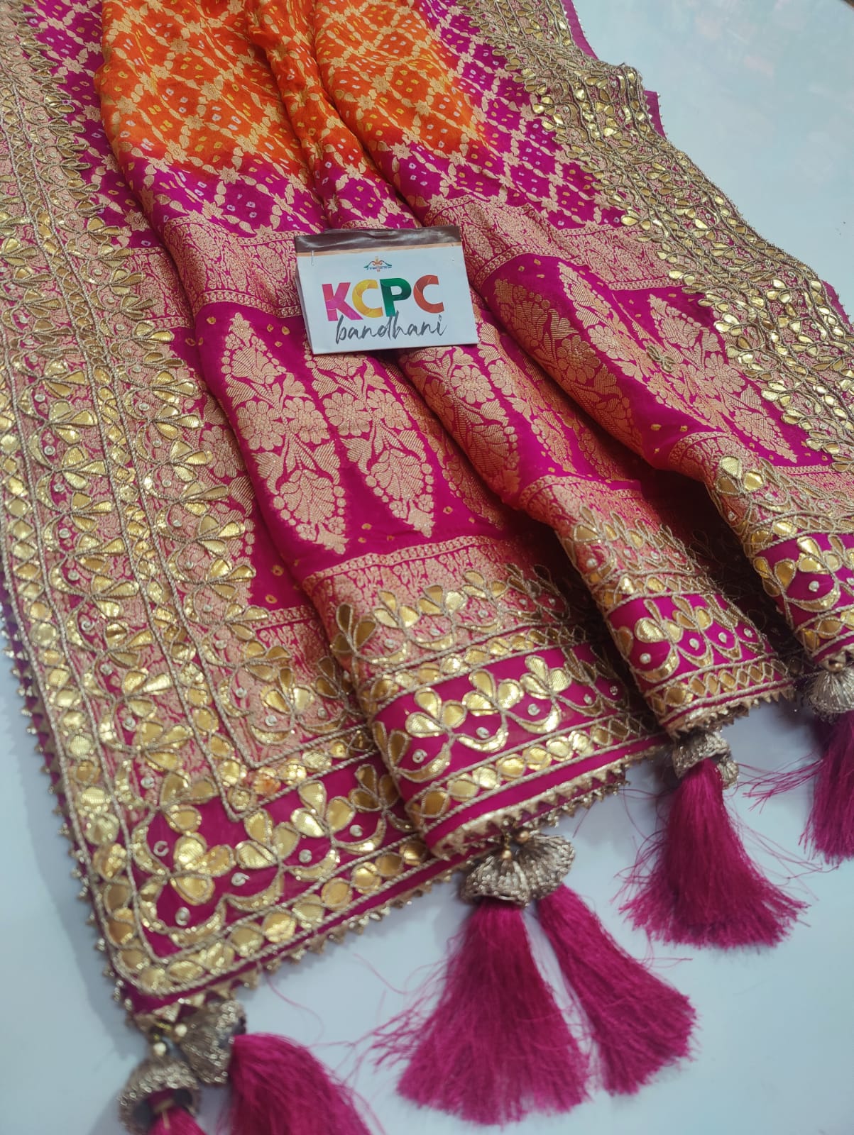 Pure Khaddi Upada Jangla Neemzari Bandhani
Ghatchola Dupatta With Gotapatti Handwork Orange Rani