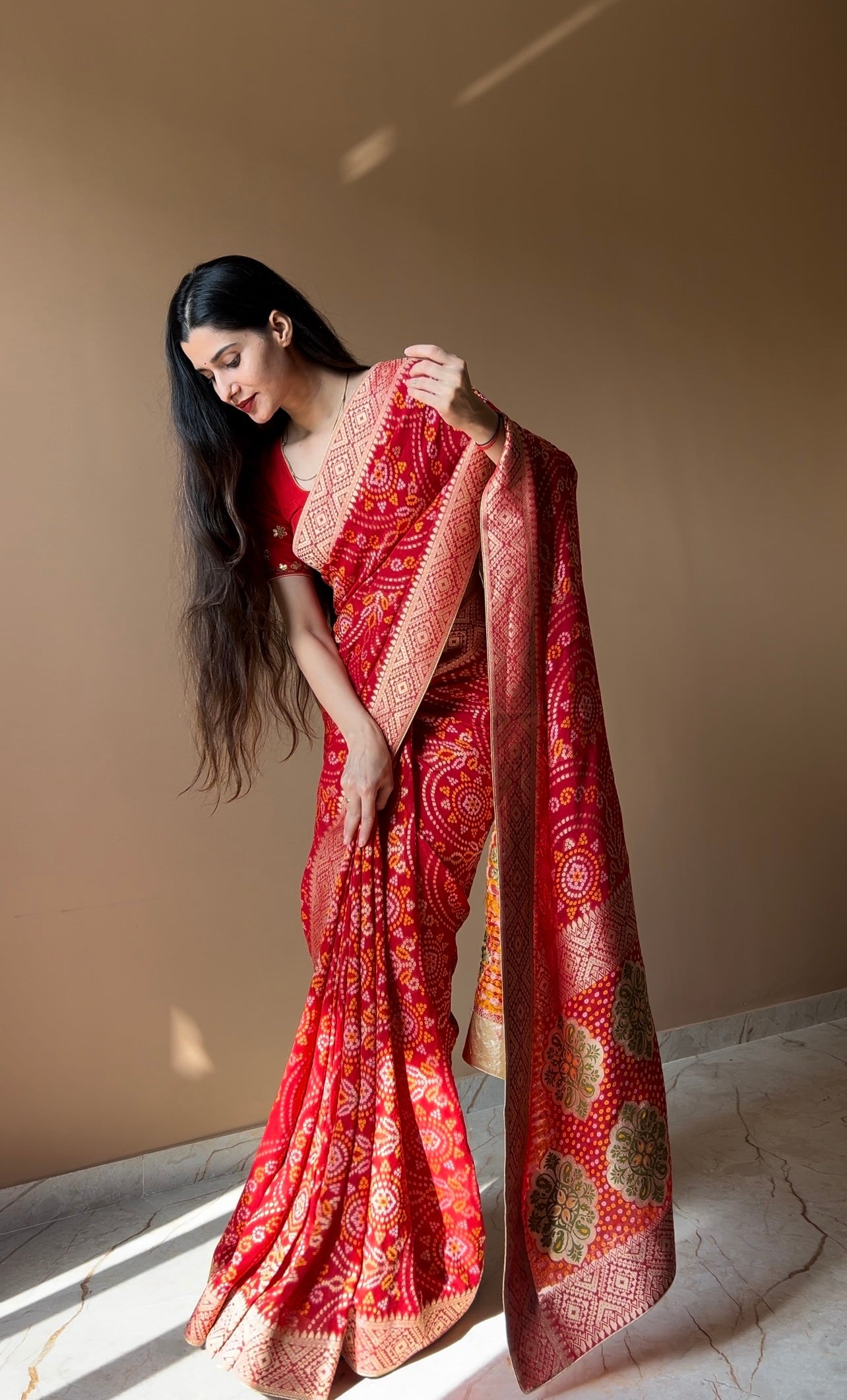 Pure georgette bandhani with zari weaving border saree