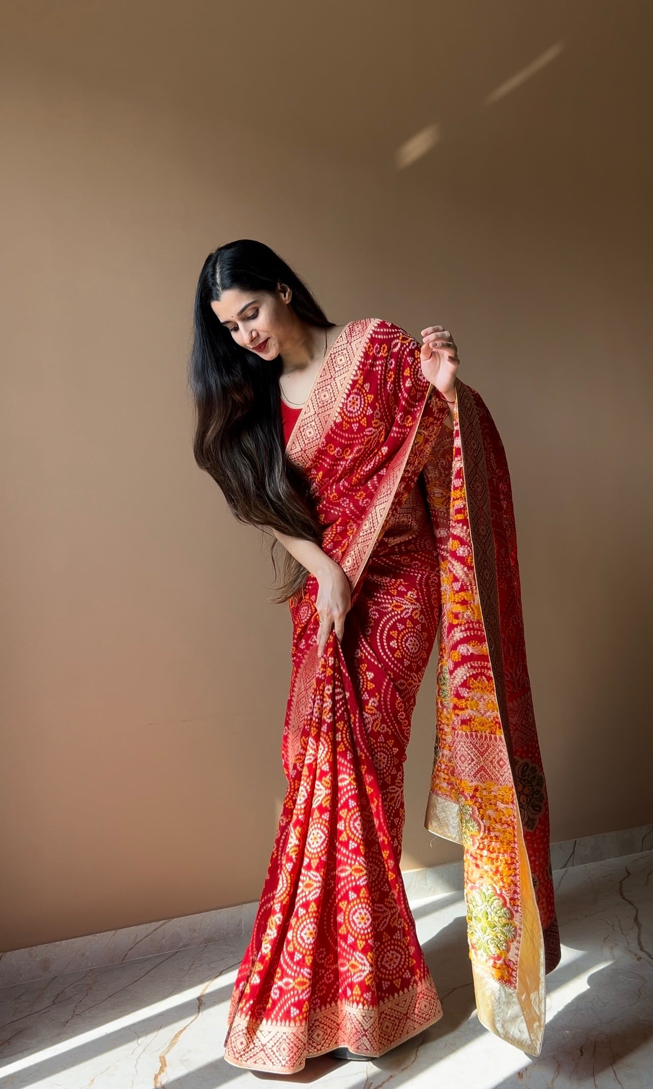 Pure georgette bandhani with zari weaving border saree