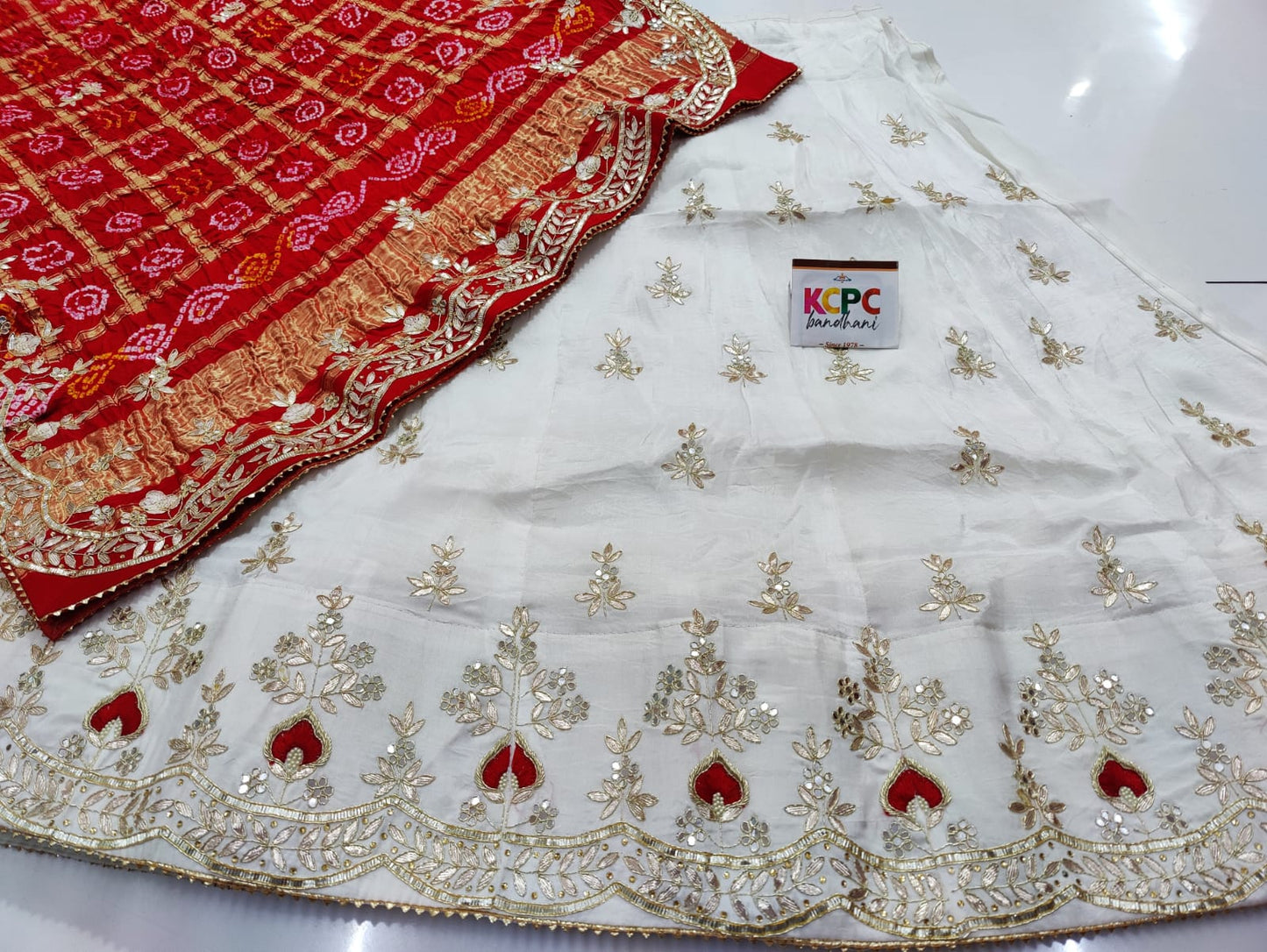 Pure Upadasilk Lehenga With Pure Gajji Silk Dupptta
Gotapatti Zardoji Moti Foil Work White - Red