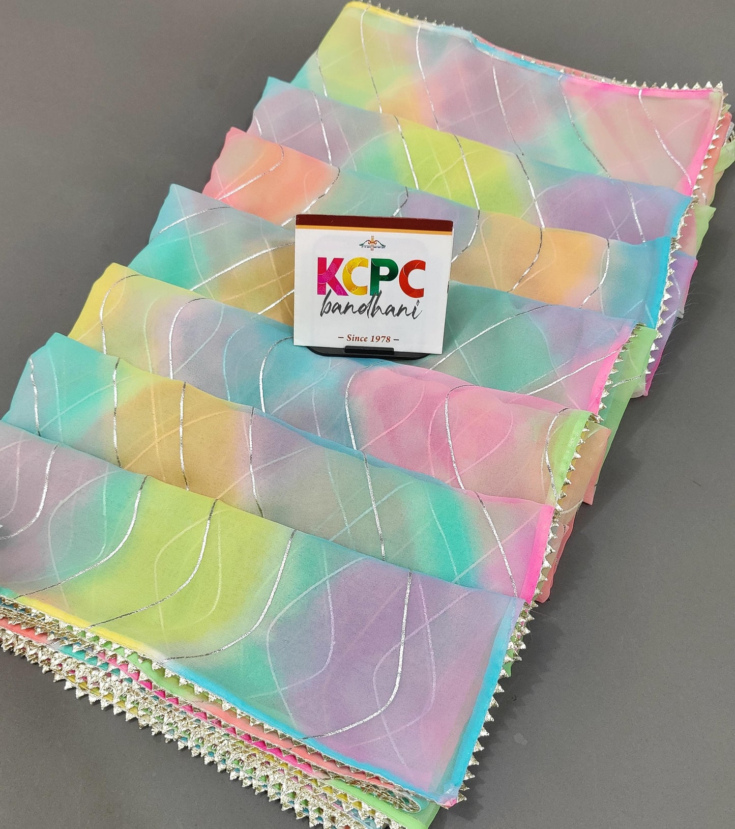 KcPc New Launching Royal Georgette Multi Color Lahariya Foil print saree swa