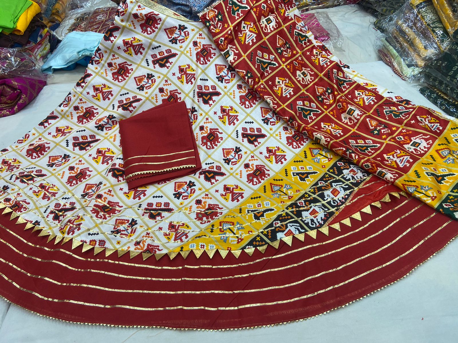 Dola Silk Patola Design With Hathi Ghoda Print Lehenga Kml Nr Cream Red Lehenga