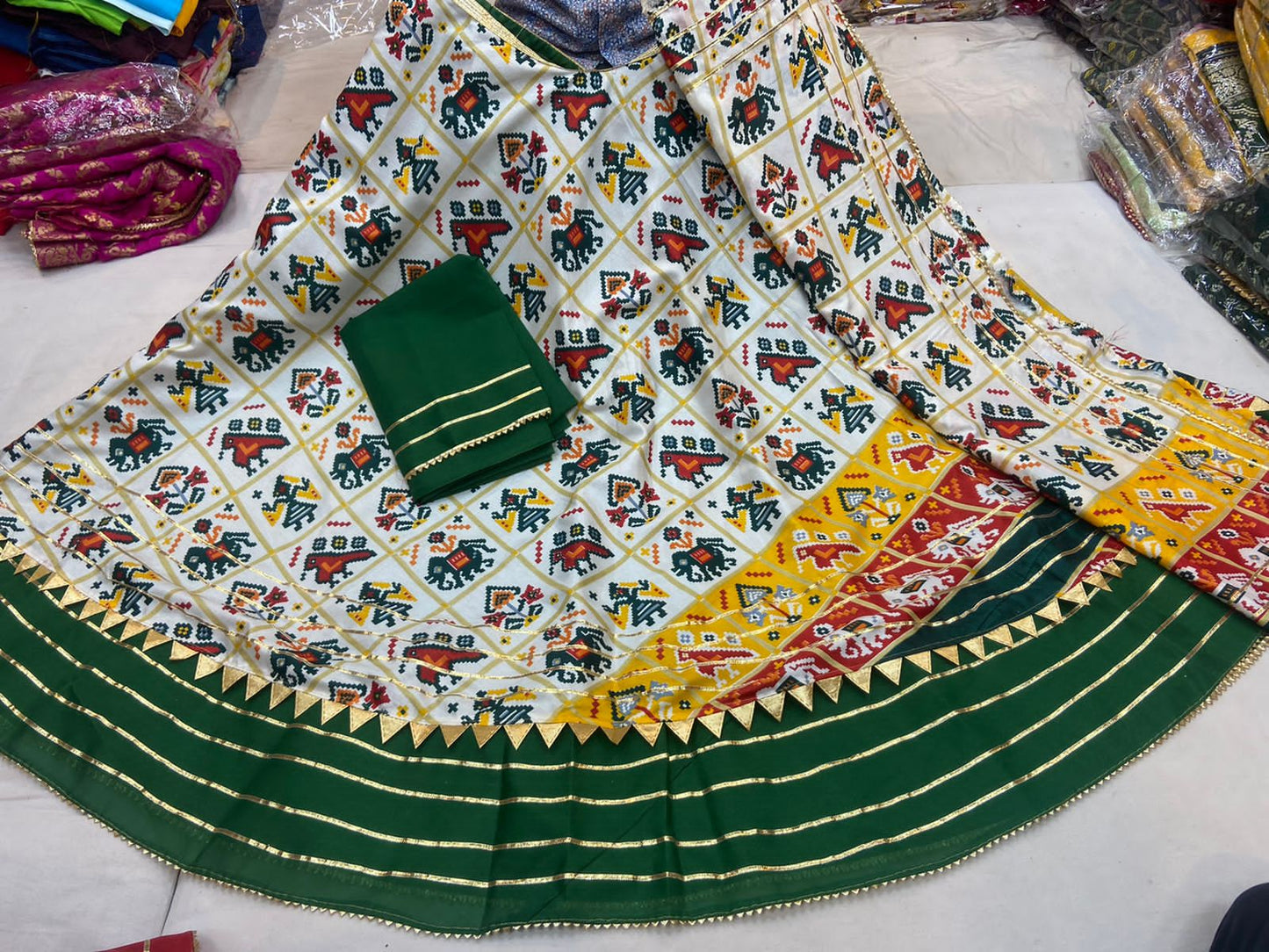 Pure Dola Silk Patola Printed With Gotaptti Work Border Lehenga Kml Or Green