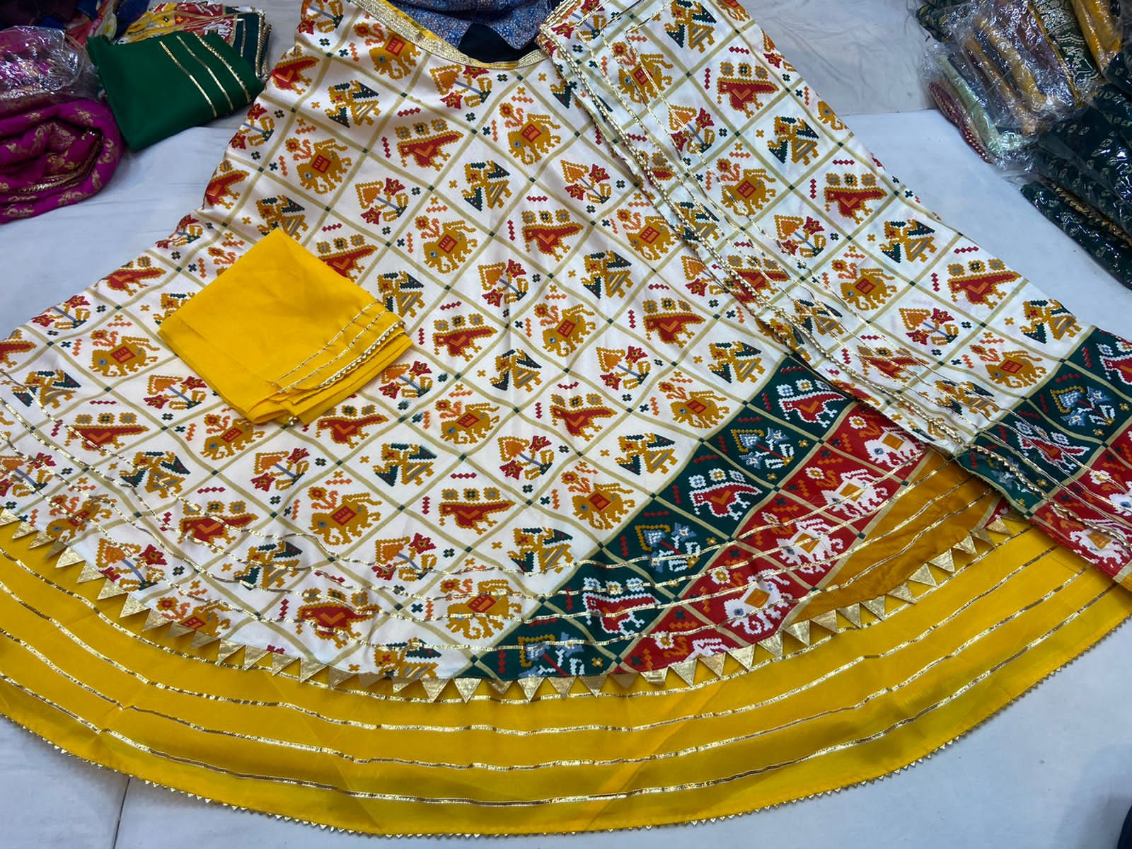 Pure Dola Silk Patola Printed With Gotaptti Work Border Lehenga Kml Or Yellow